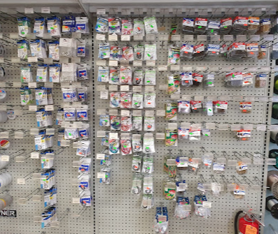Pegboard wall of hooks, jigs and terminal tackle