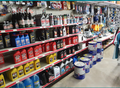 Shelves of motor oil, marine paint and boat supplies